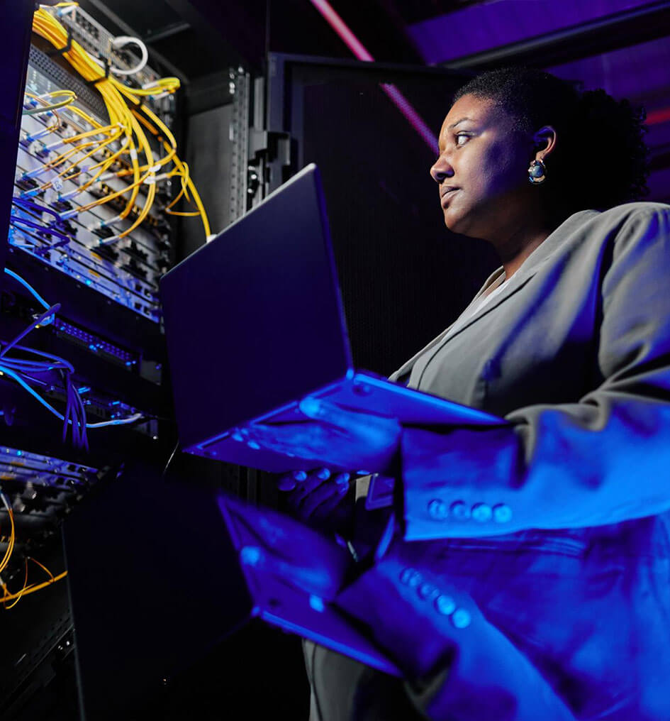 Woman working at a server stack